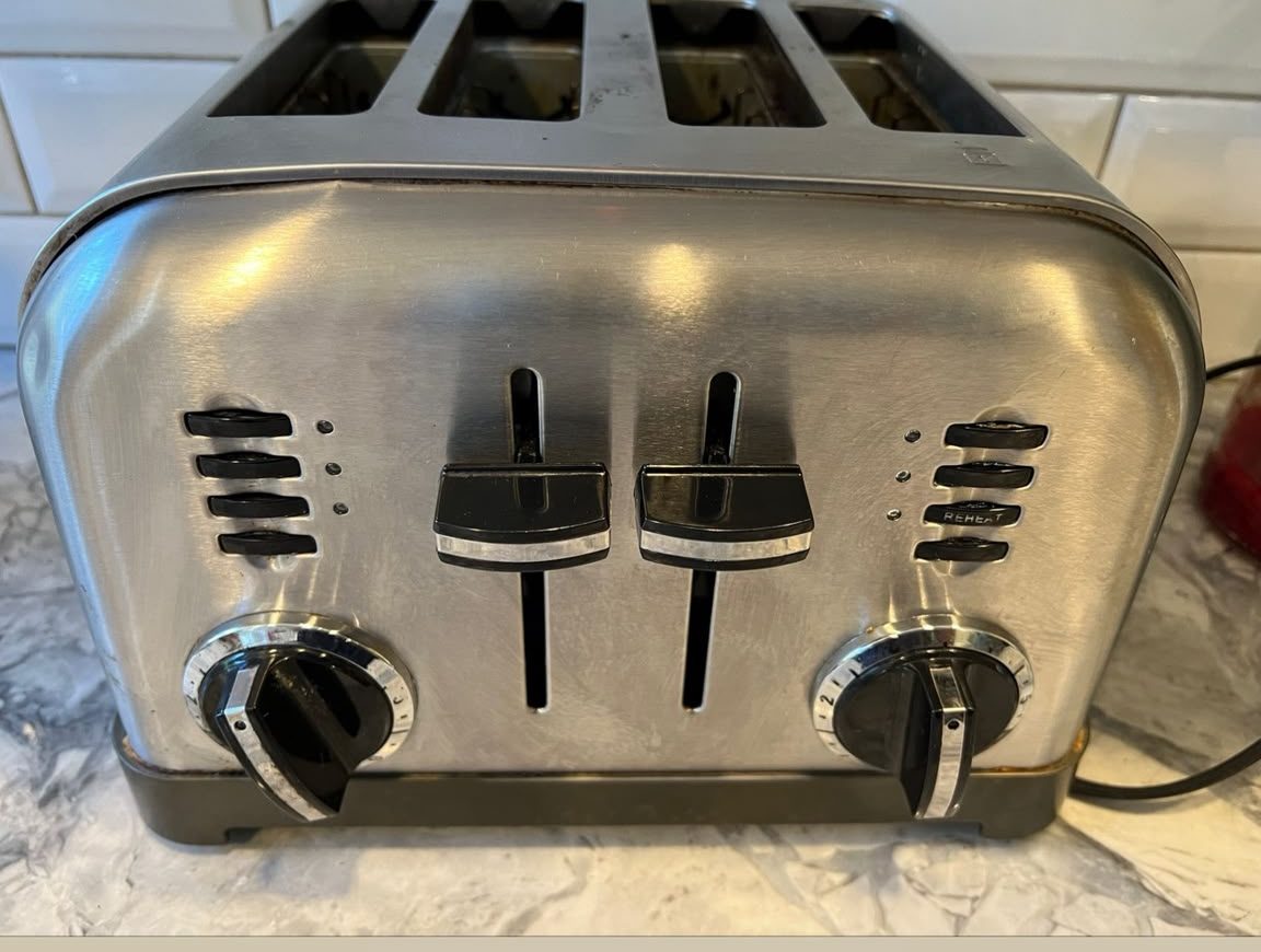 Polished toaster and subway-tile backsplash after kitchen cleaning
