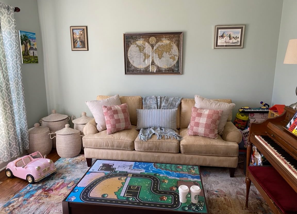 Tidy family room reset with styled sofa pillows