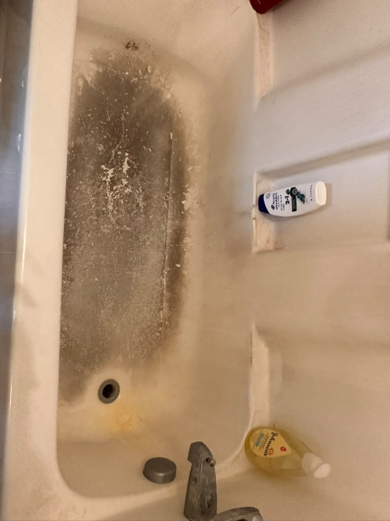 Bathtub needing a deep clean before a move-in/move-out service in Richmond, VA